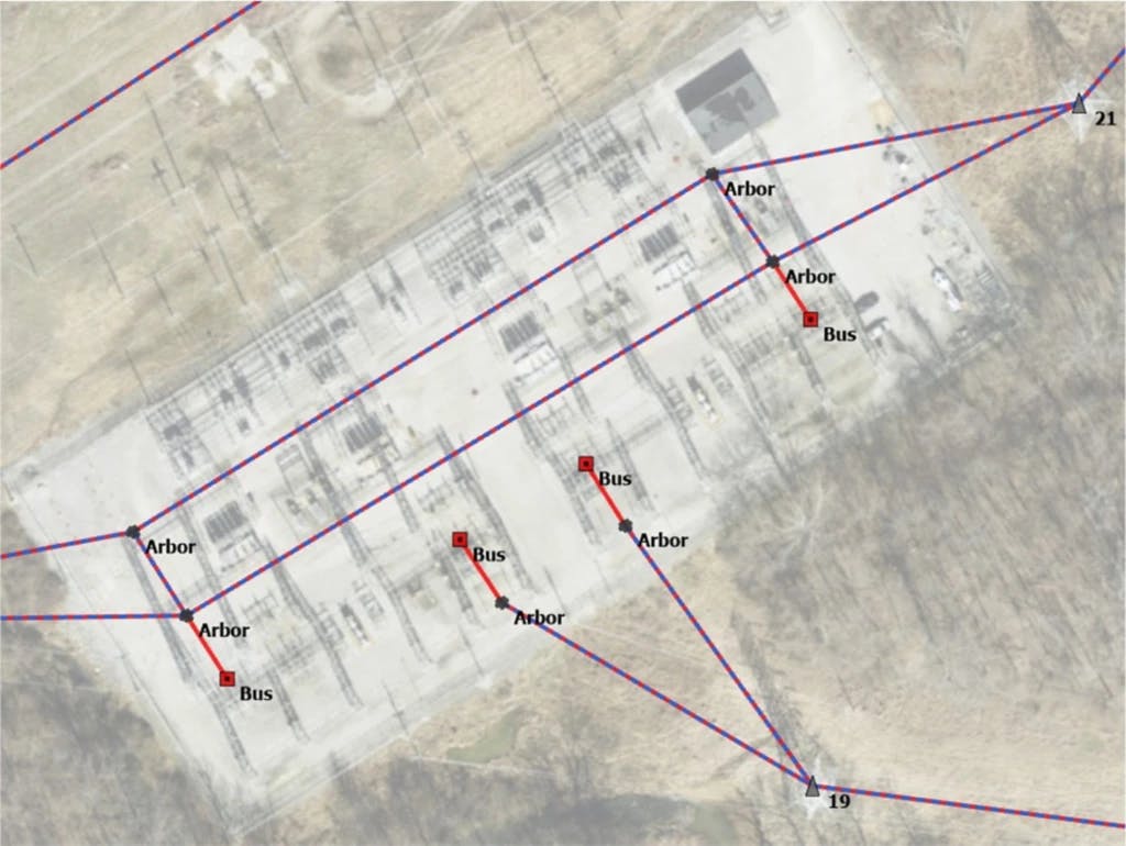 Aerial view of an industrial site with power lines and features labeled in purple and red