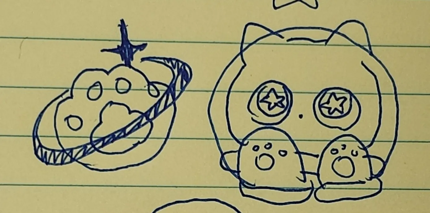 종이 위에 고양이와 별을 그린 그림