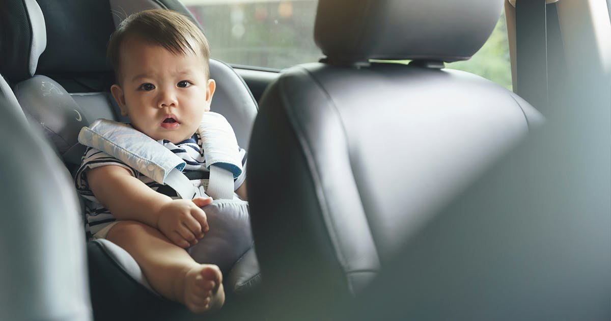 A baby sitting in a car seat