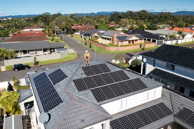 solar installer on roof